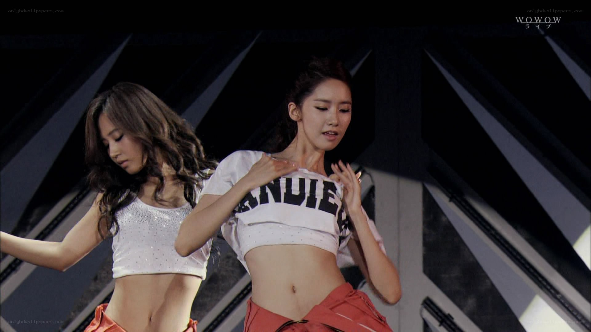two women performing on stage