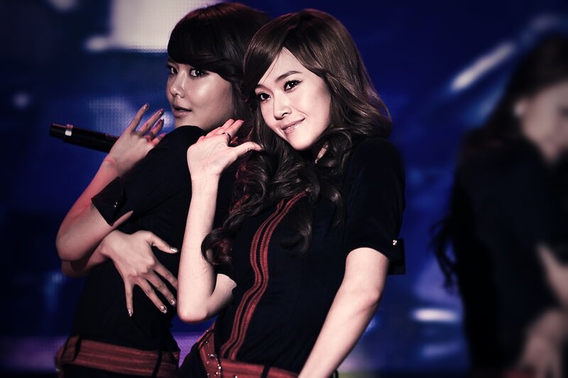 two women performing on stage