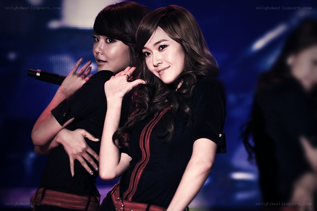 two women performing on stage