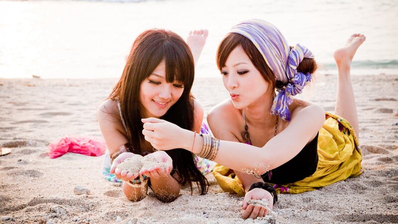 Two women playing on the beach