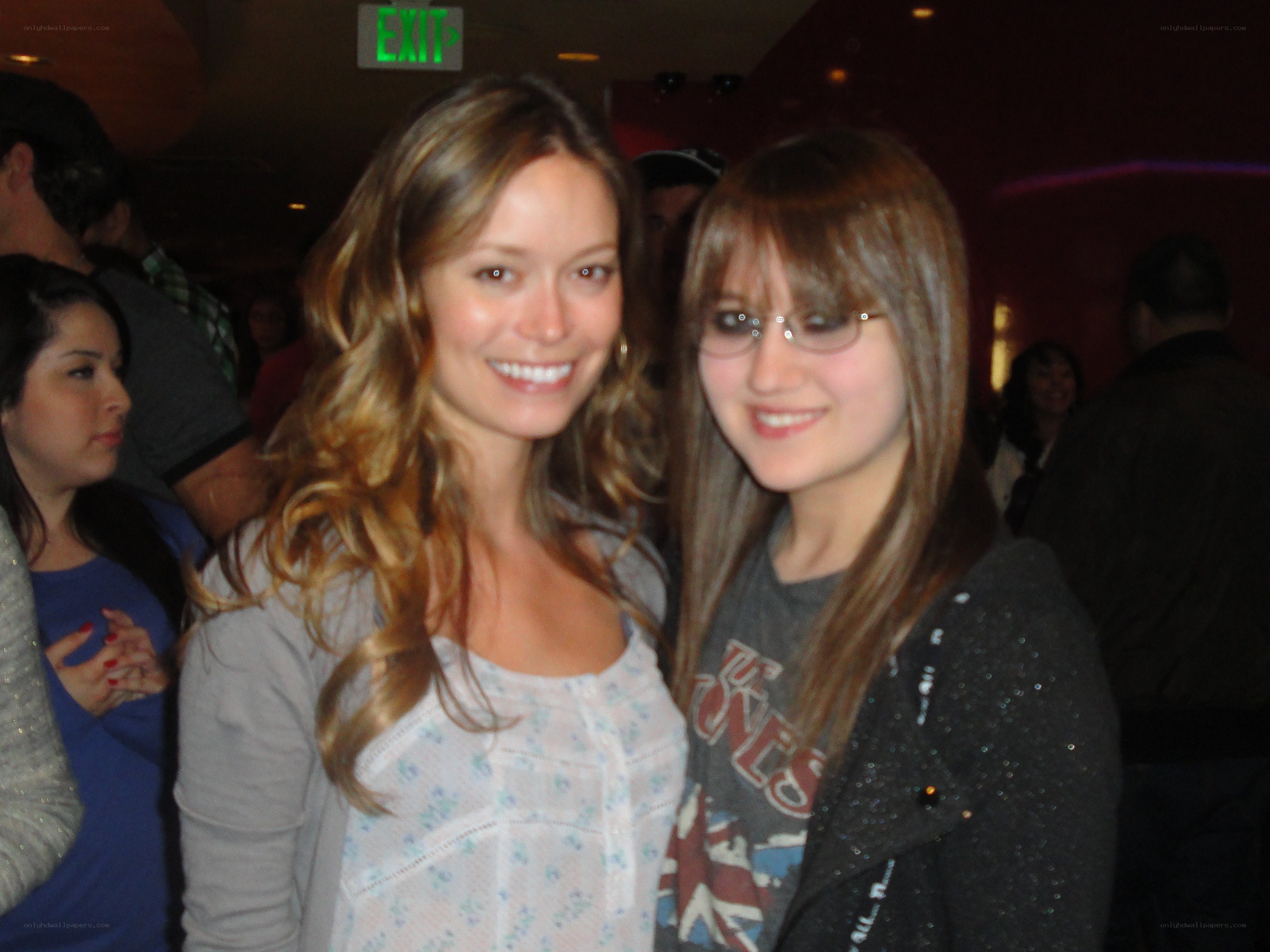 Two women posing at a party