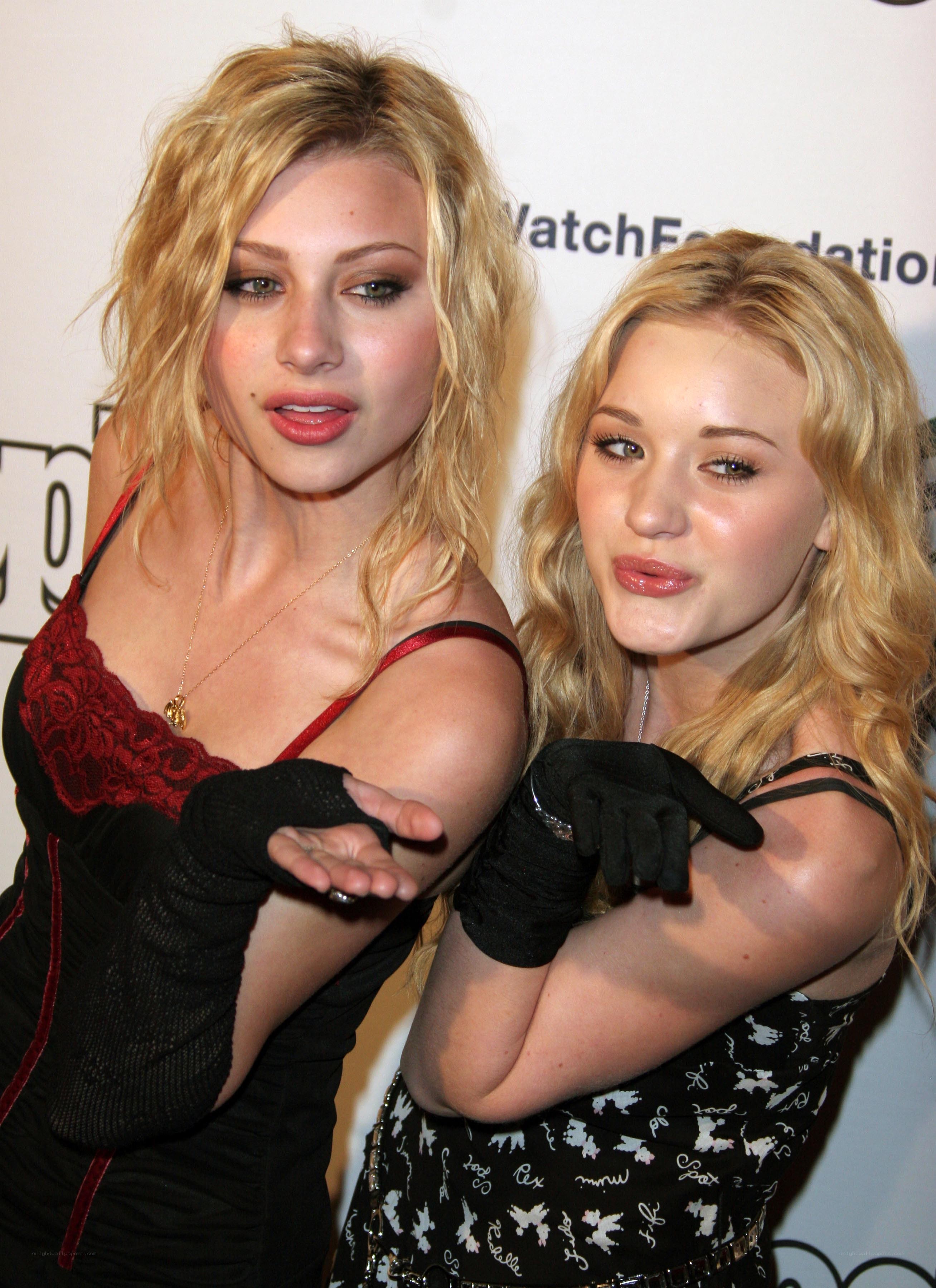 two women posing at event