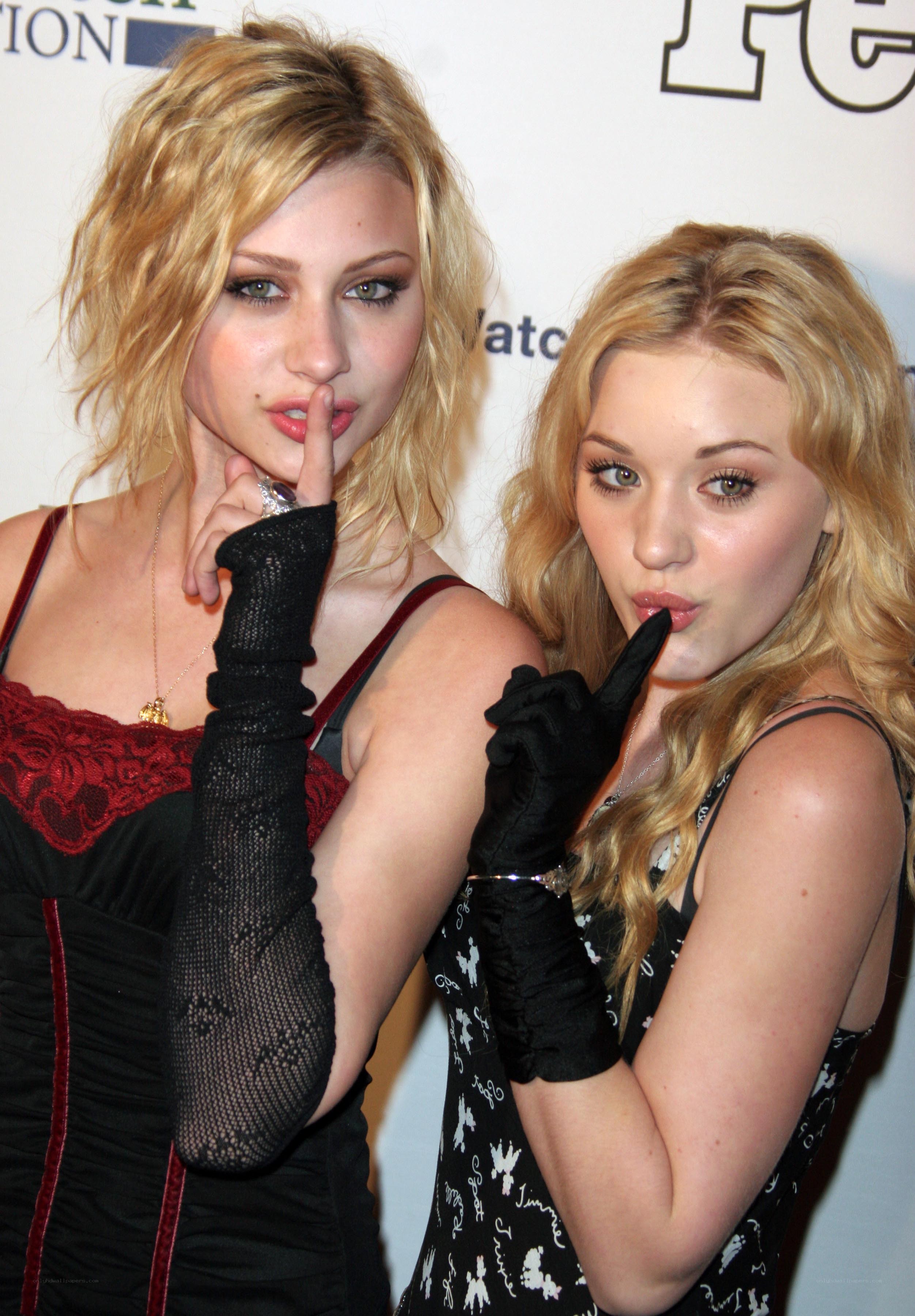 Two women posing at event