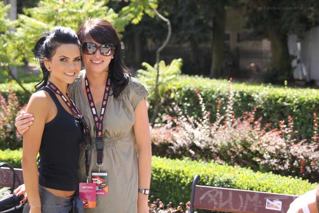 Two women posing in a park