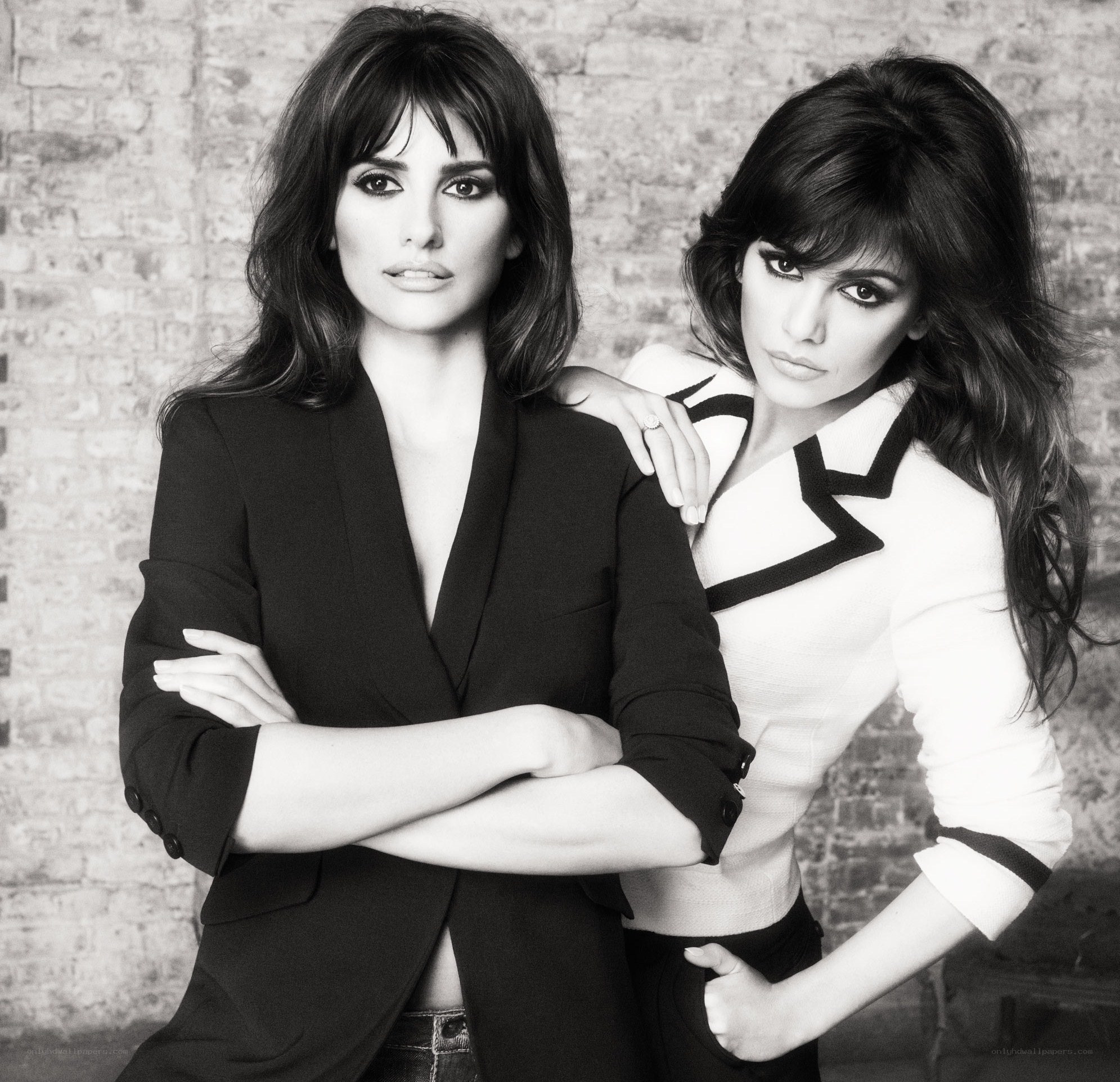Two women posing in black and white