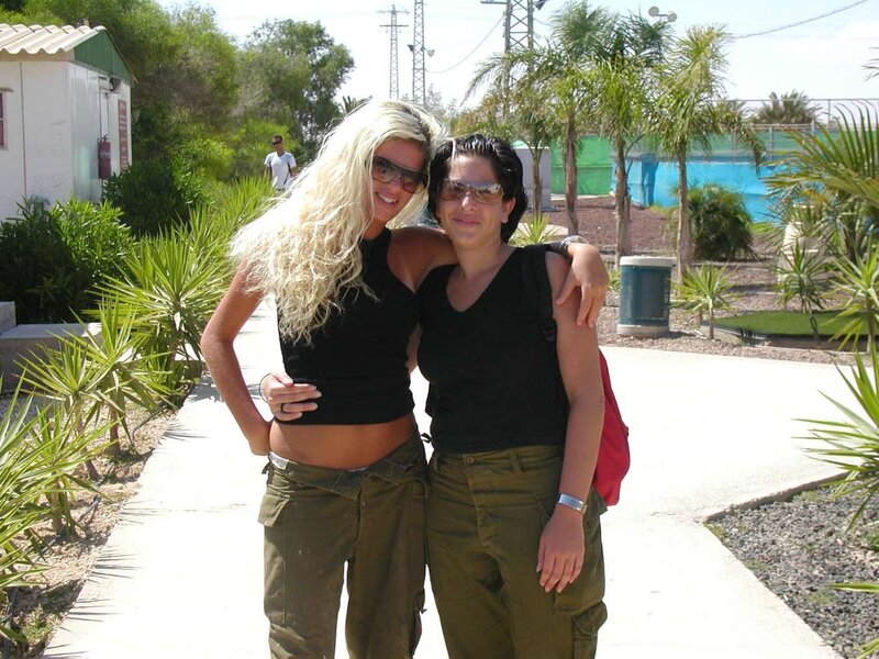 Two women posing on a path