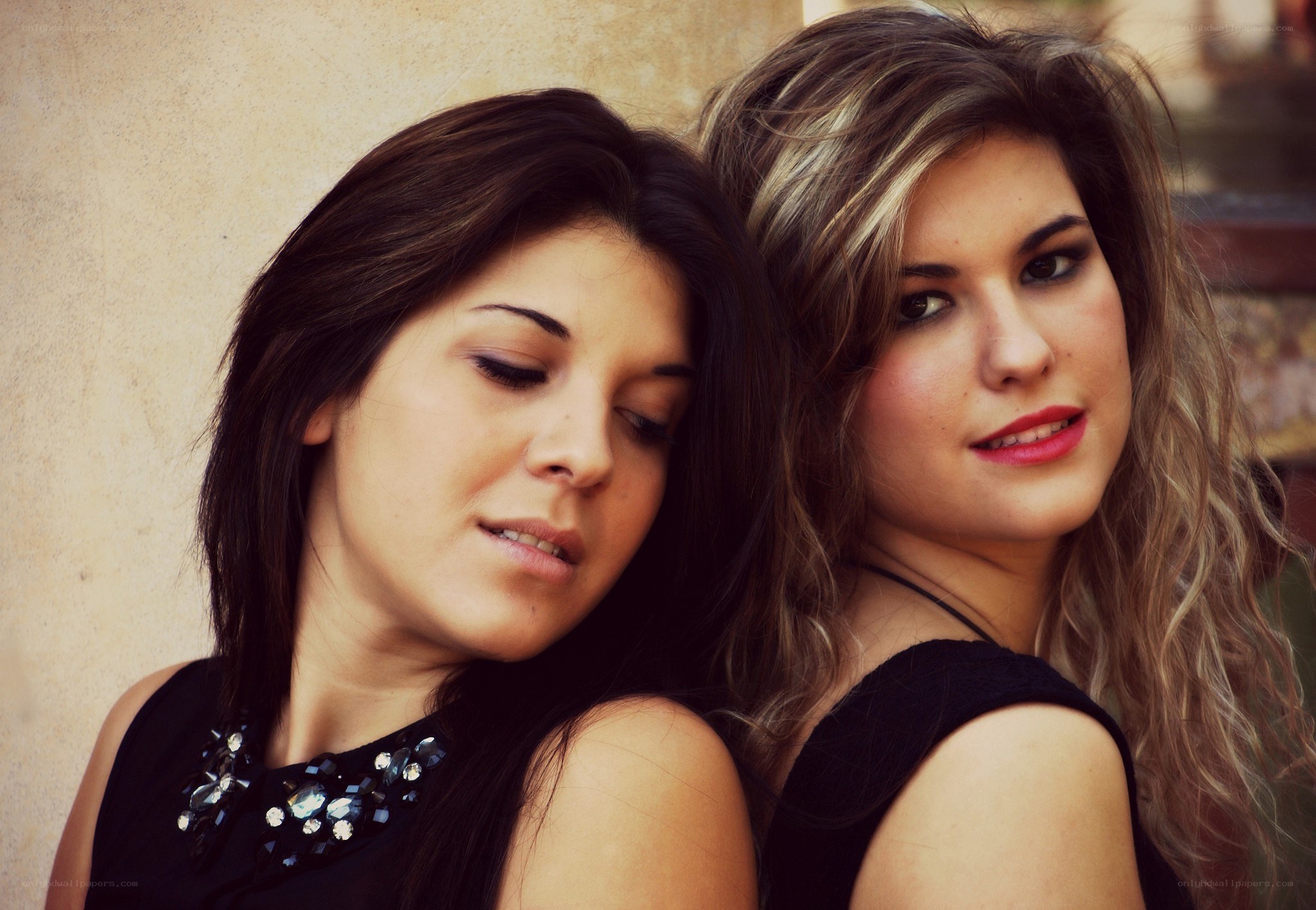 two women posing together
