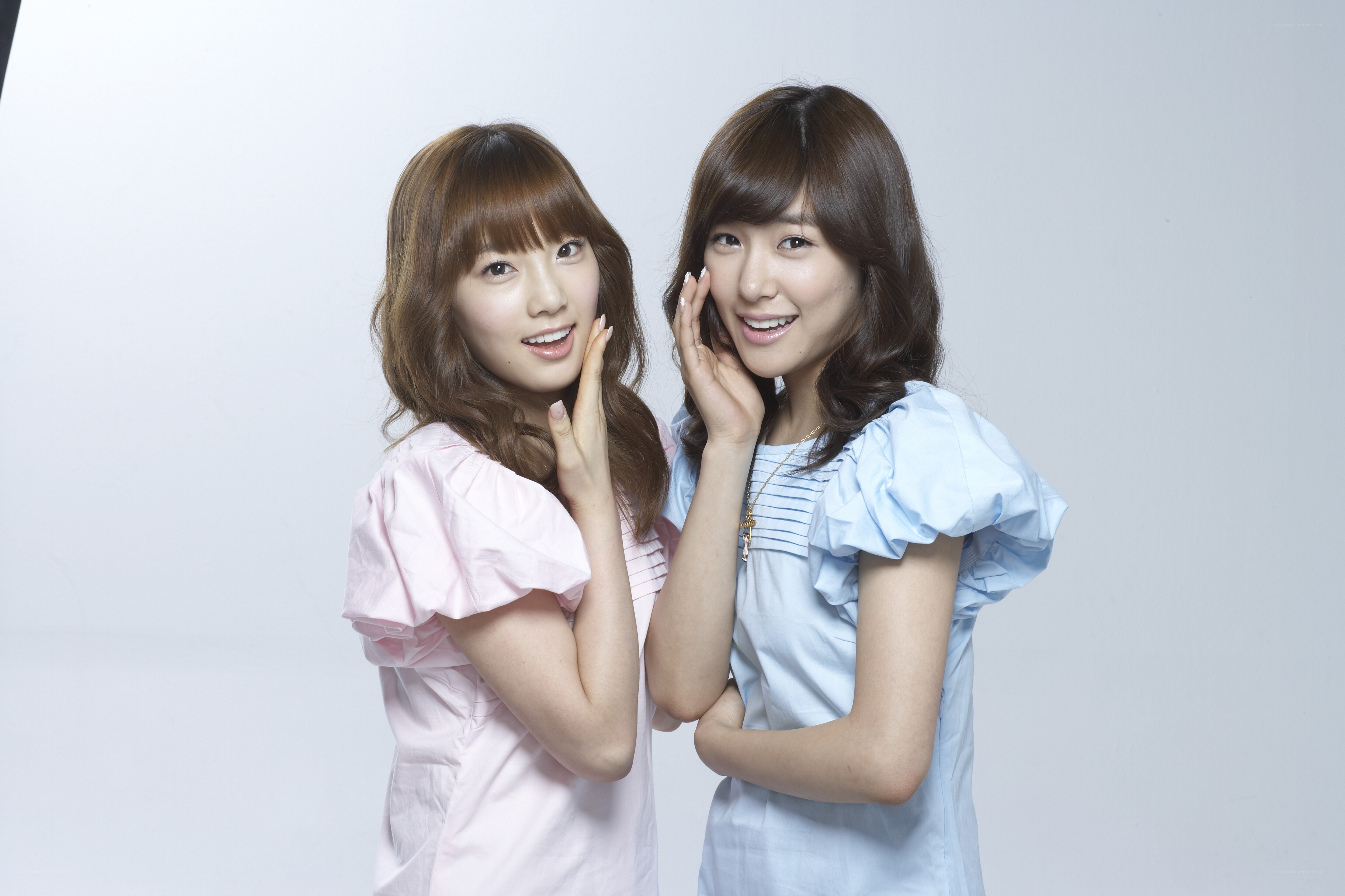 two women posing together