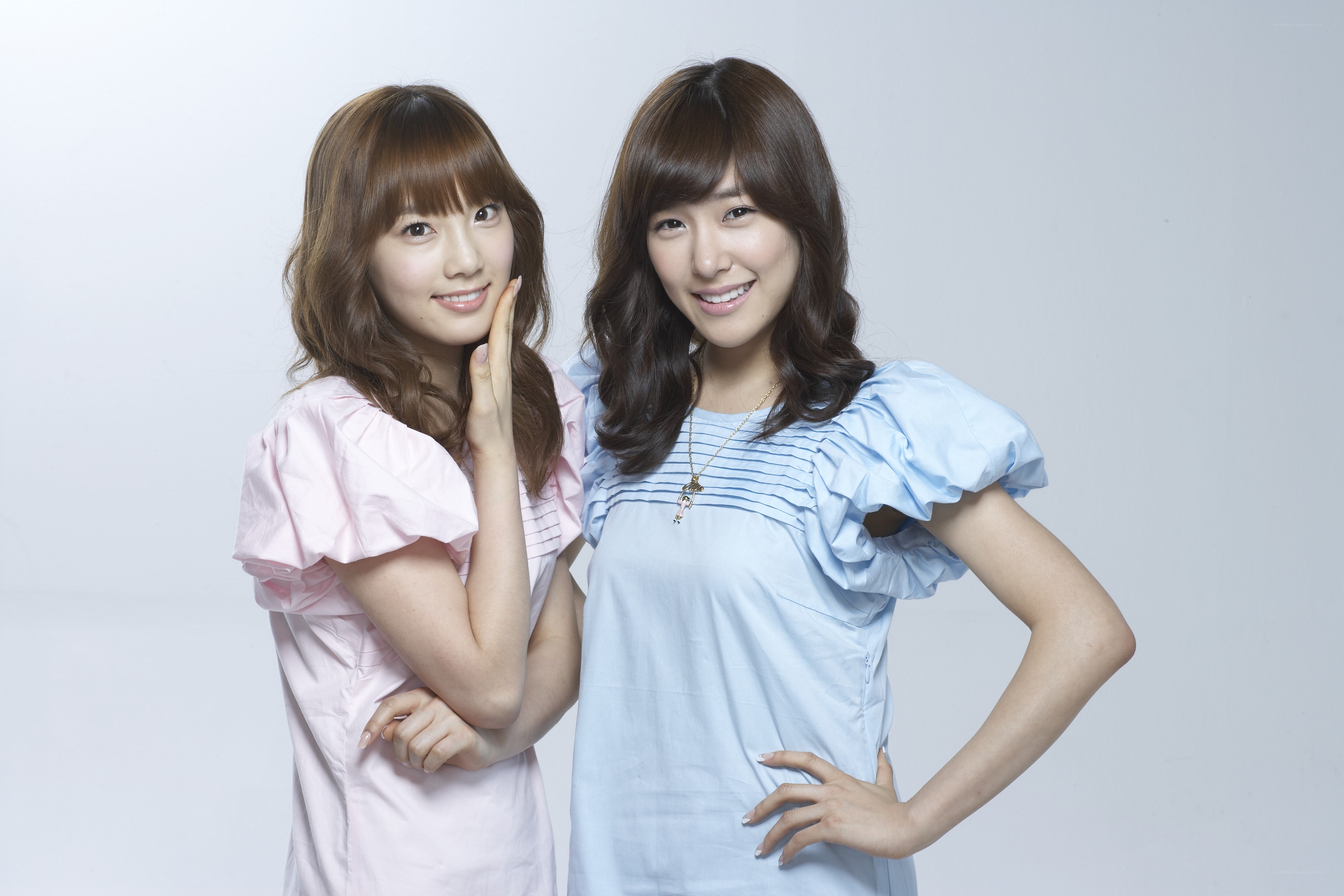 two women posing together