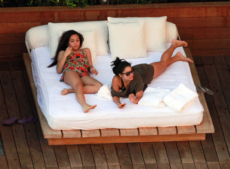 Two women relaxing on a daybed