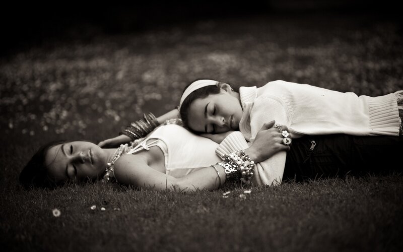 Two women resting on grass