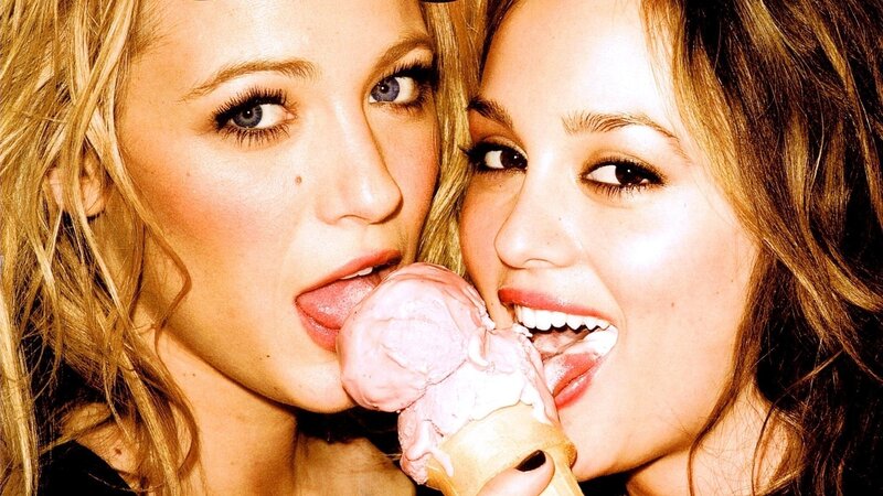 two women sharing ice cream