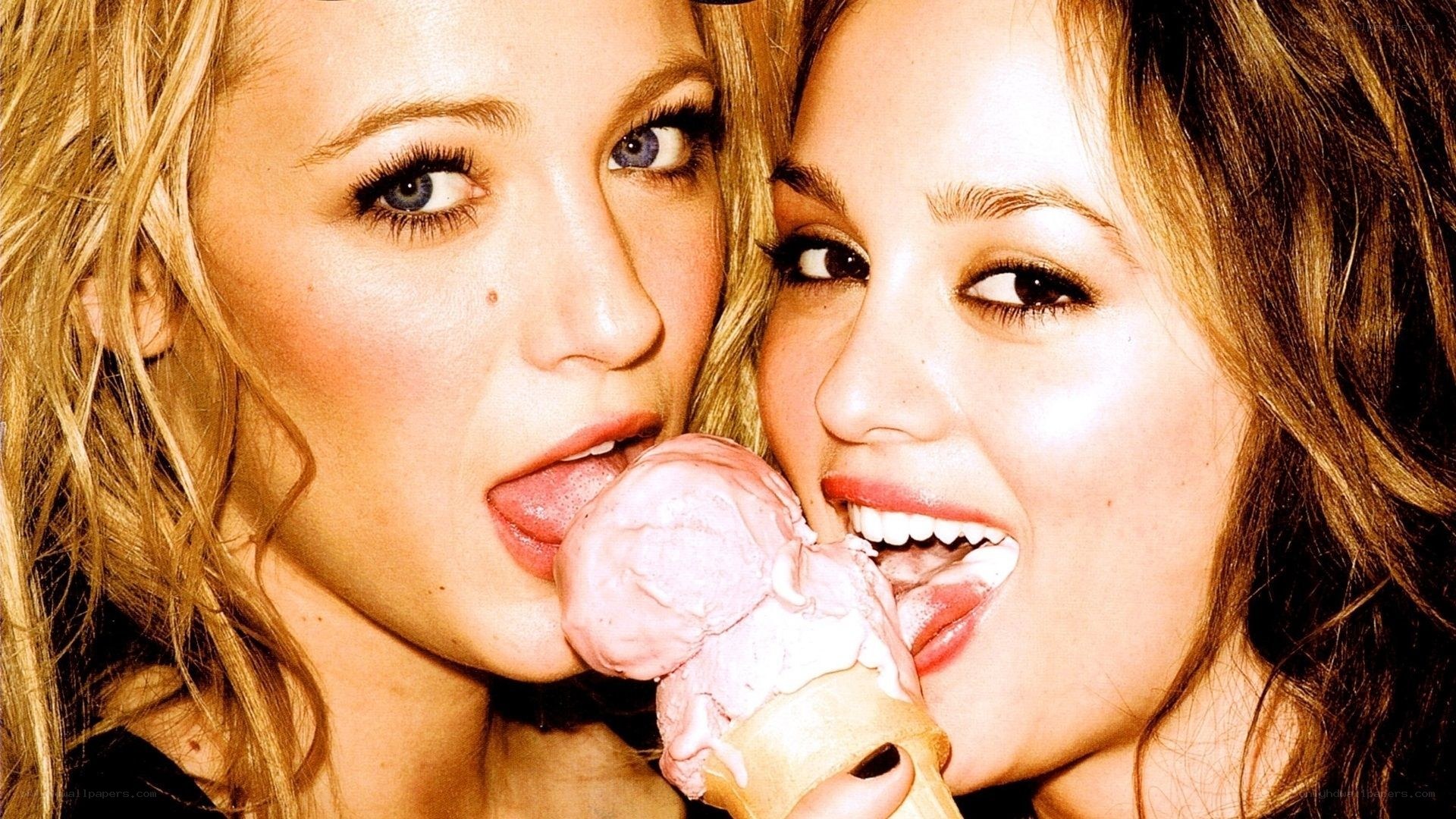 two women sharing ice cream