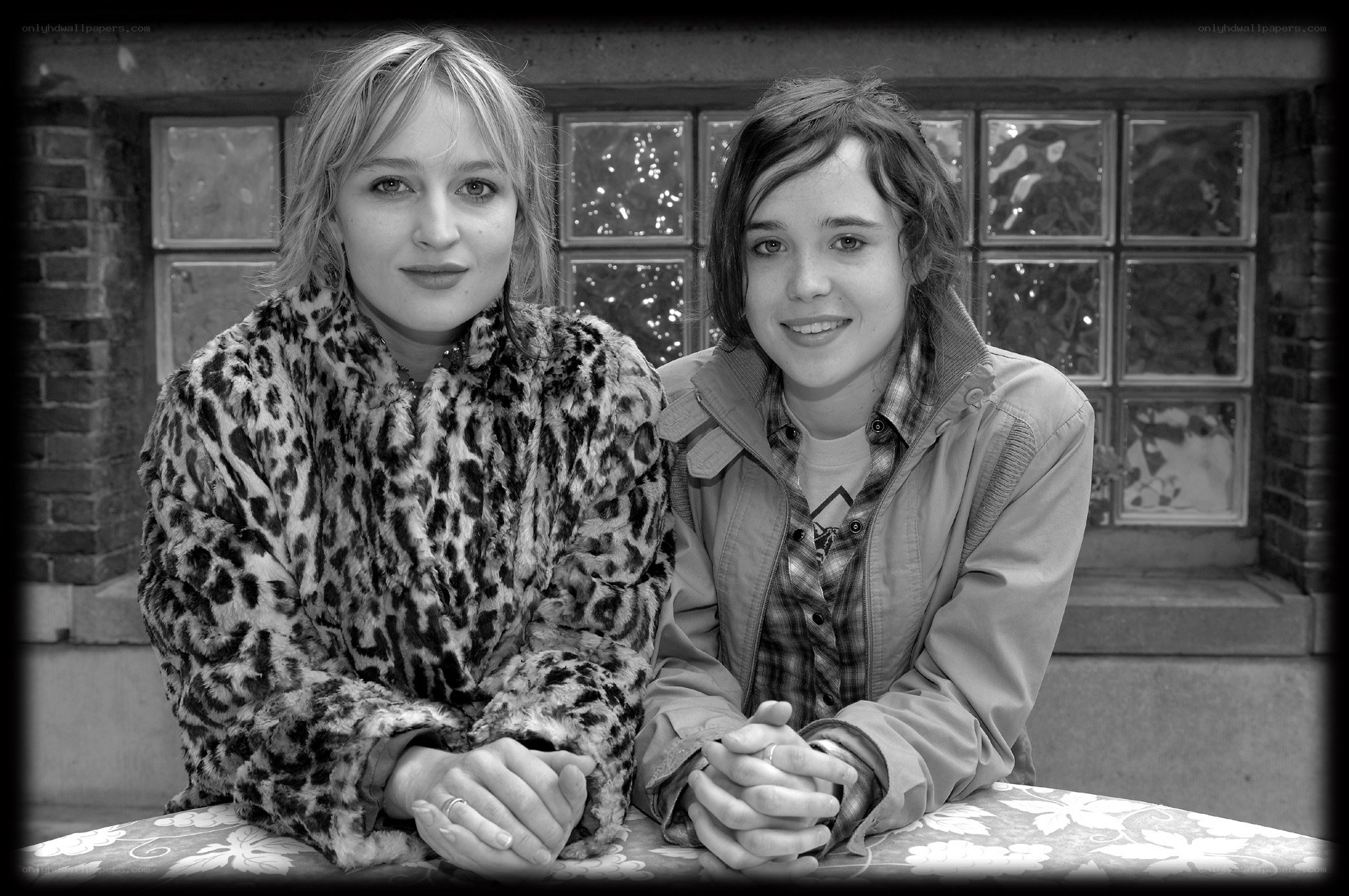 two women sitting at a table