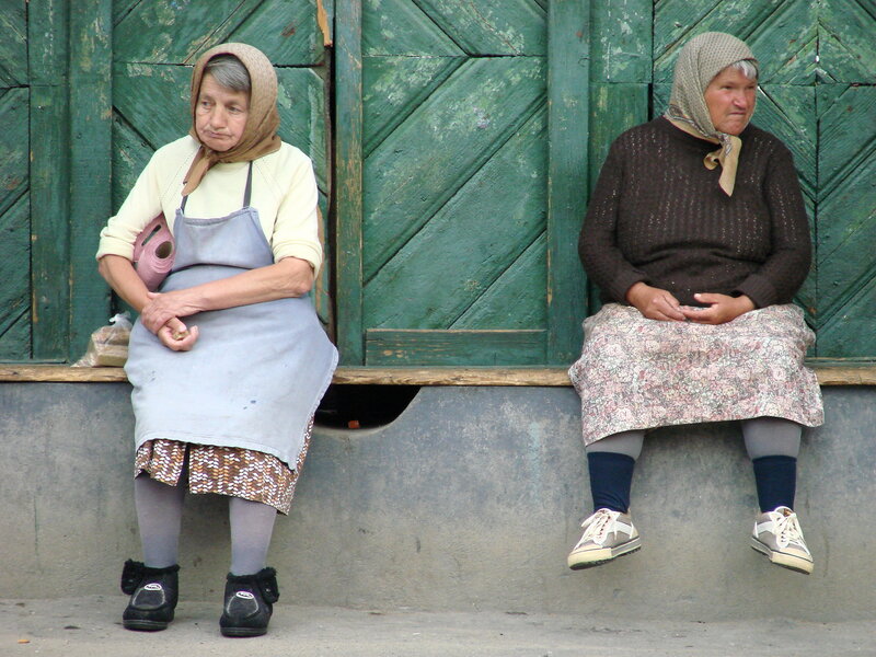 Two women sitting on a bench