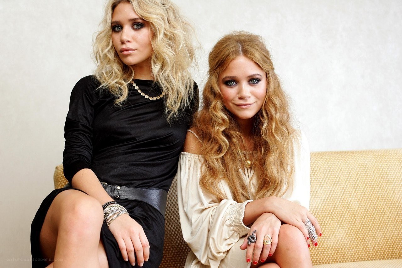 two women sitting on a couch