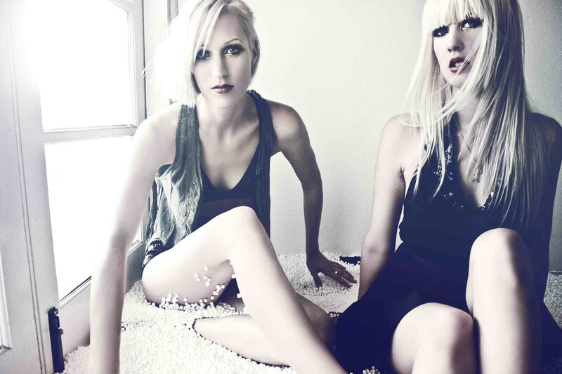 two women sitting on beads