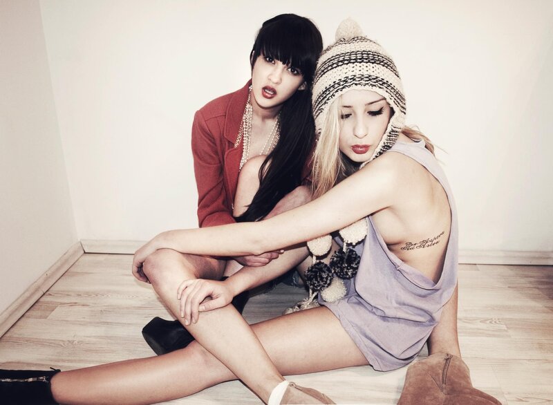Two Women Sitting on Floor — White