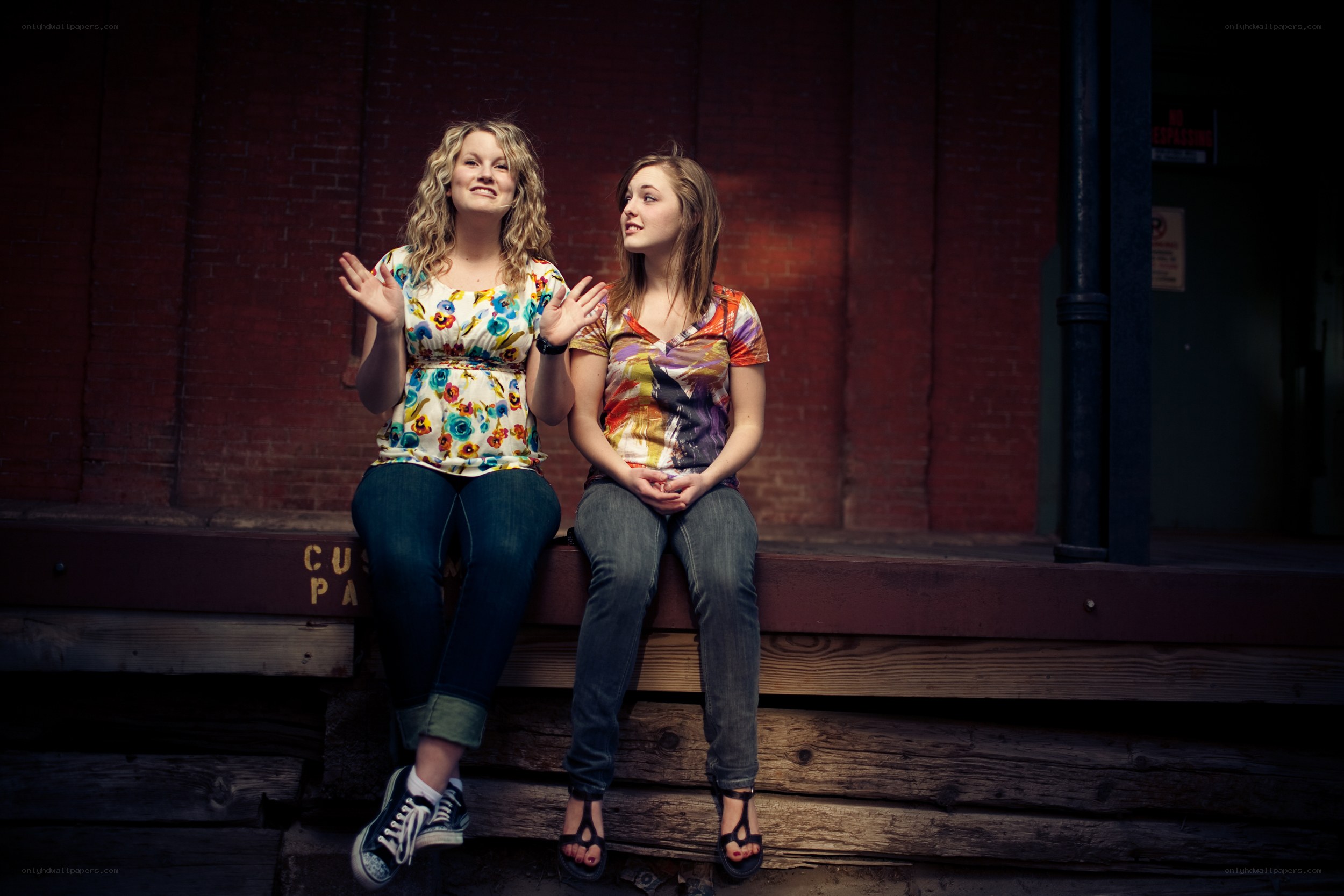 Two women sitting on steps