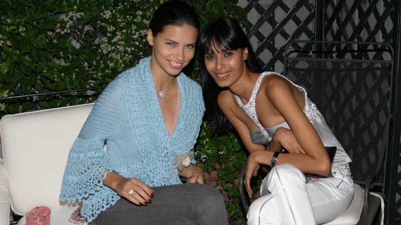 Two Women Sitting Together — White