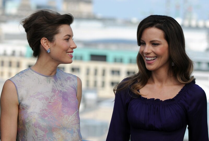Two women smiling at each other
