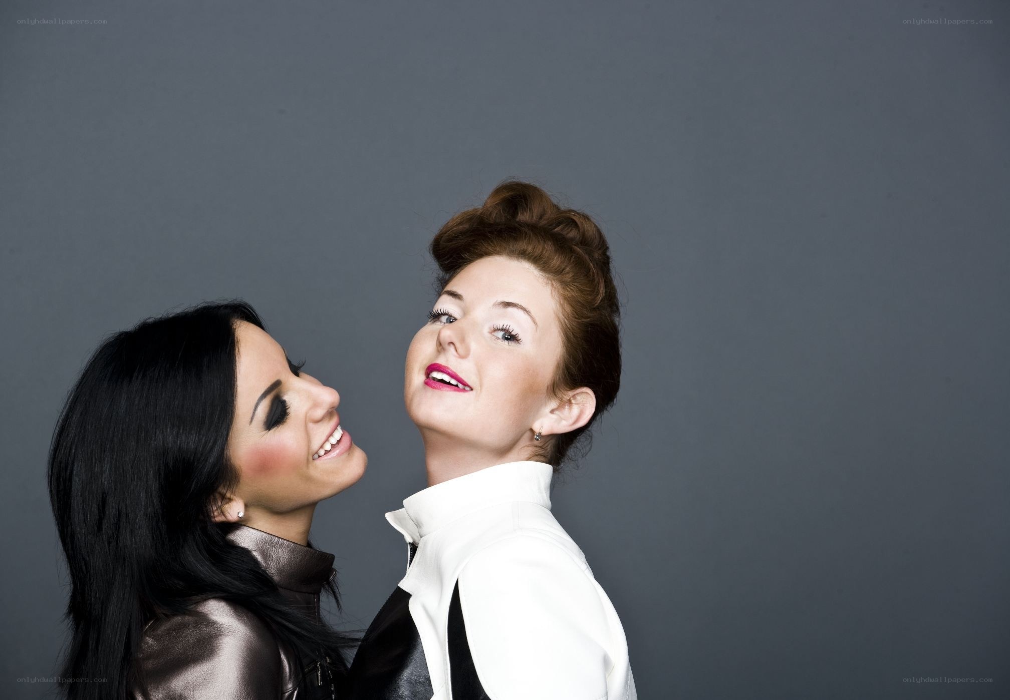 two women smiling at each other