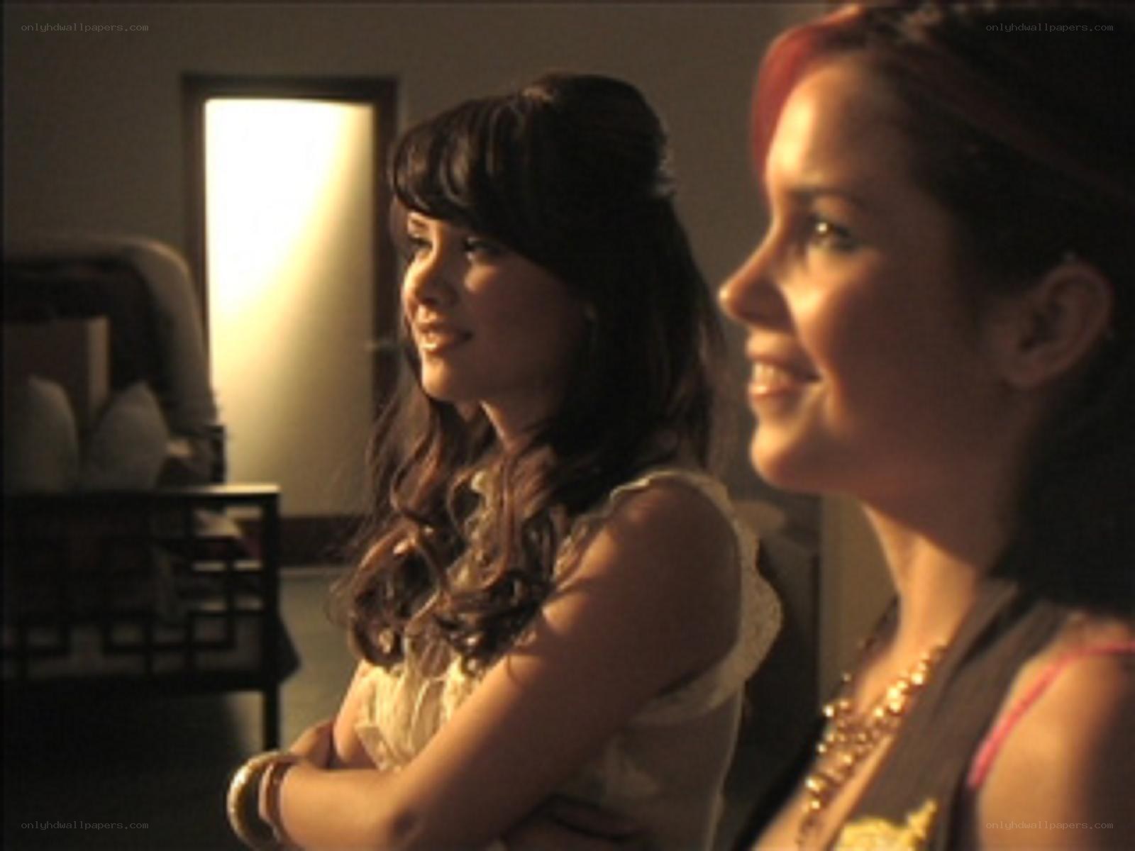 two women smiling in a room