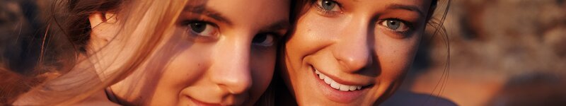 Two Women Smiling — Orange