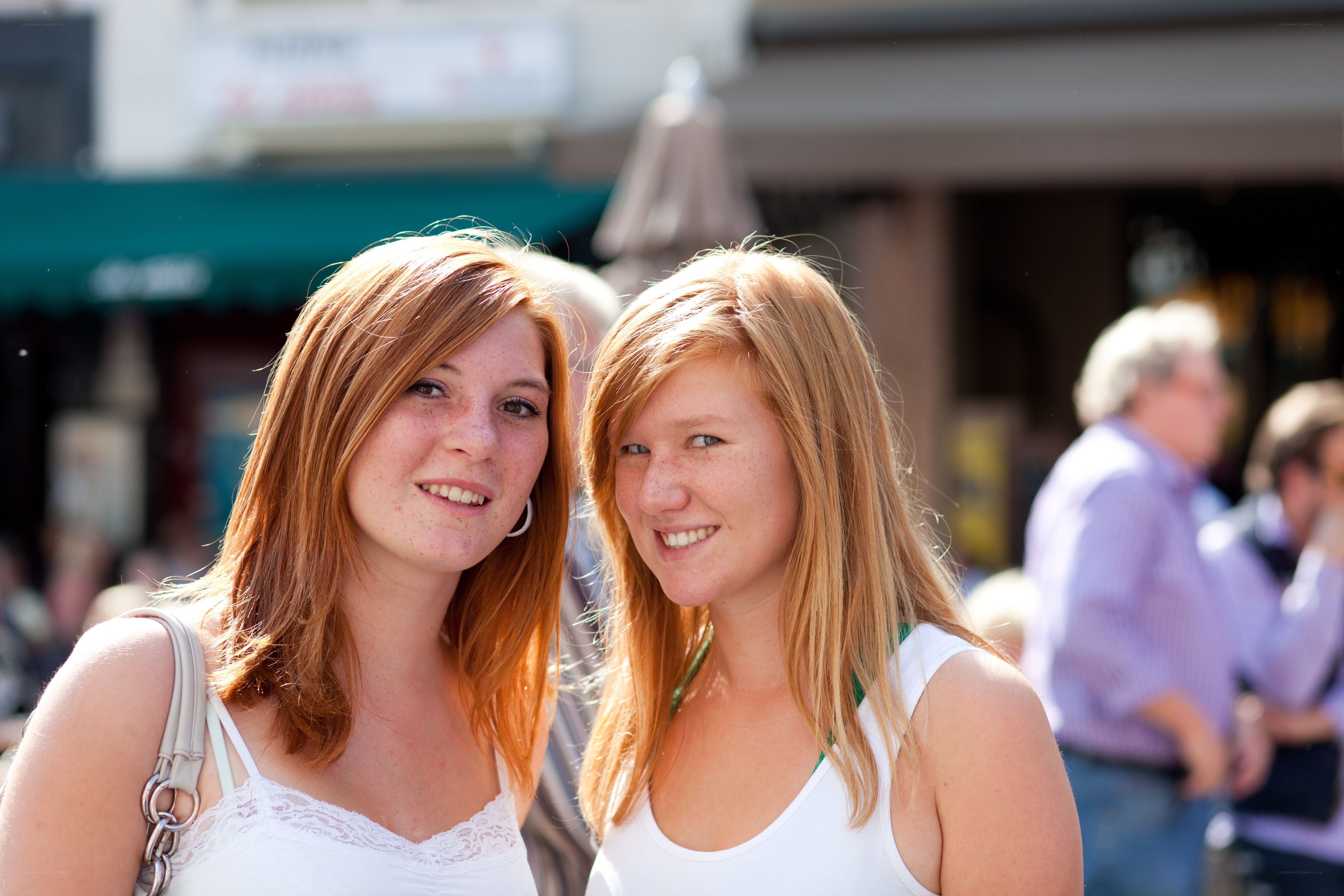 two women smiling outdoors