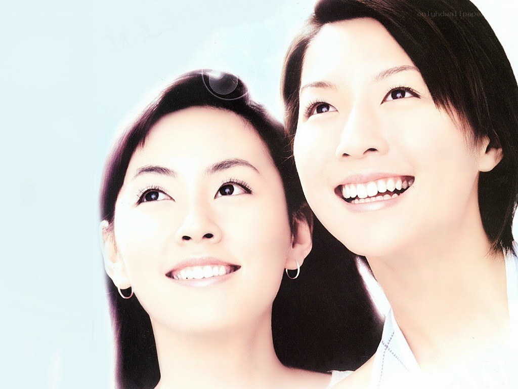 two women smiling together