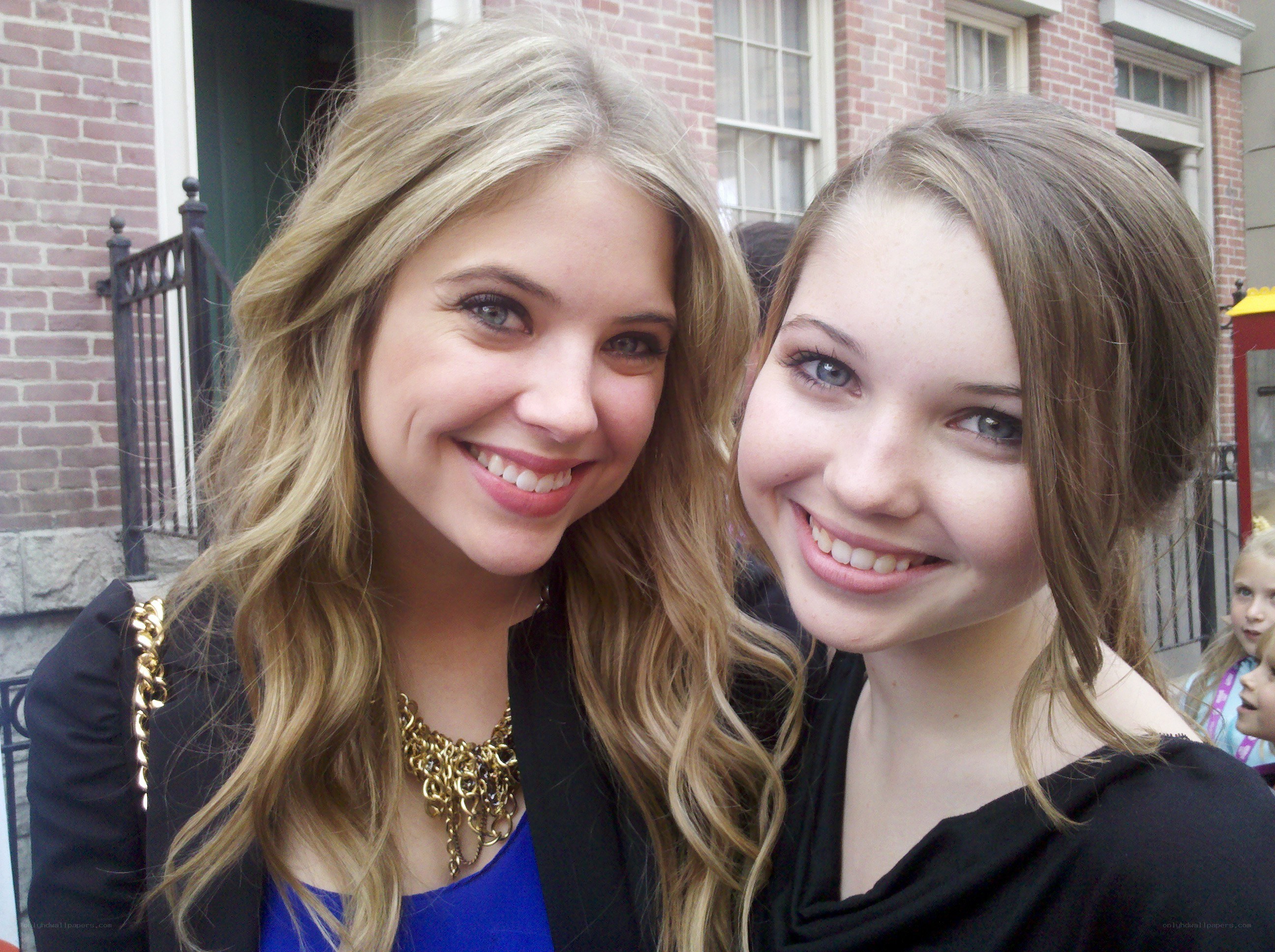 two women smiling together