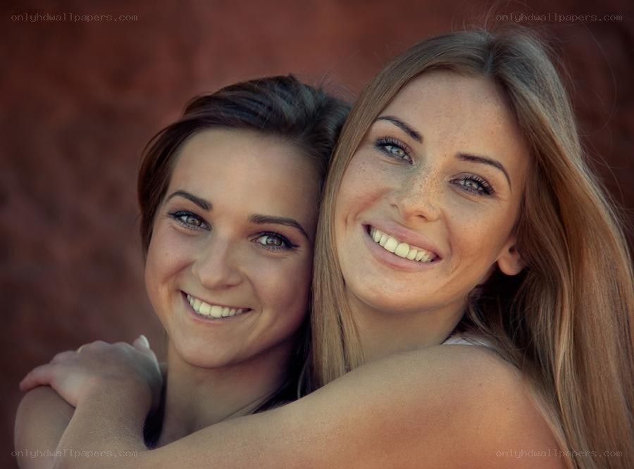 Two women smiling together