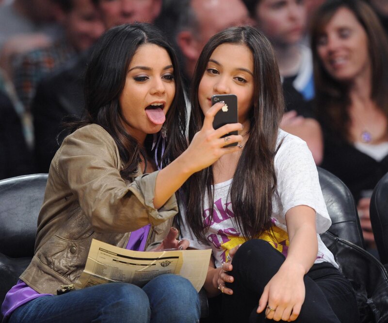 Two women taking a selfie at a game