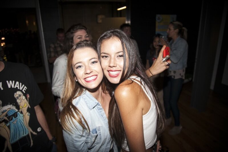 Two women taking a selfie at a party