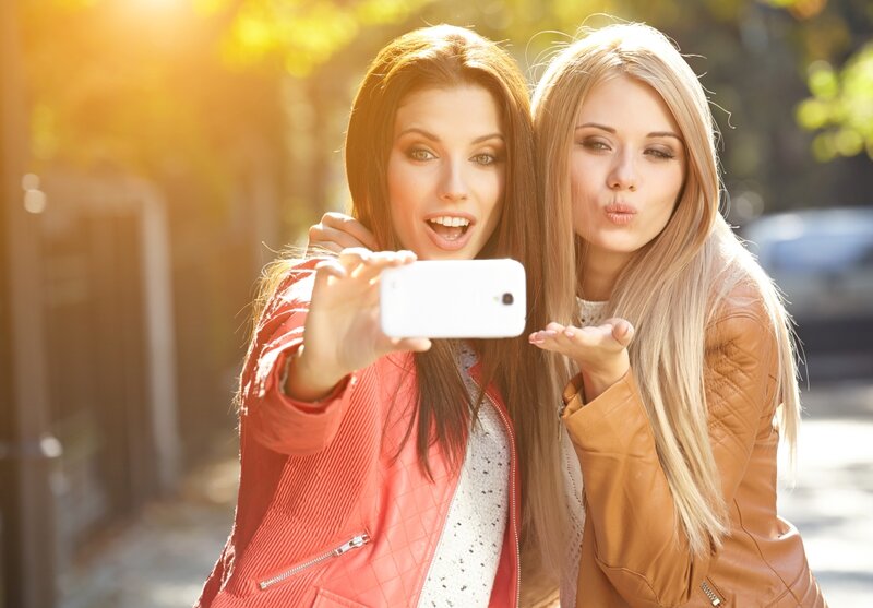 Two Women Taking Selfie — White
