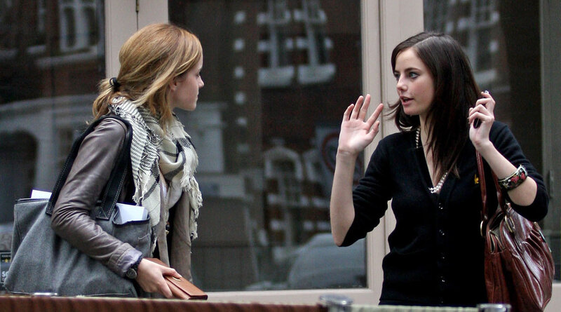 two women talking on street