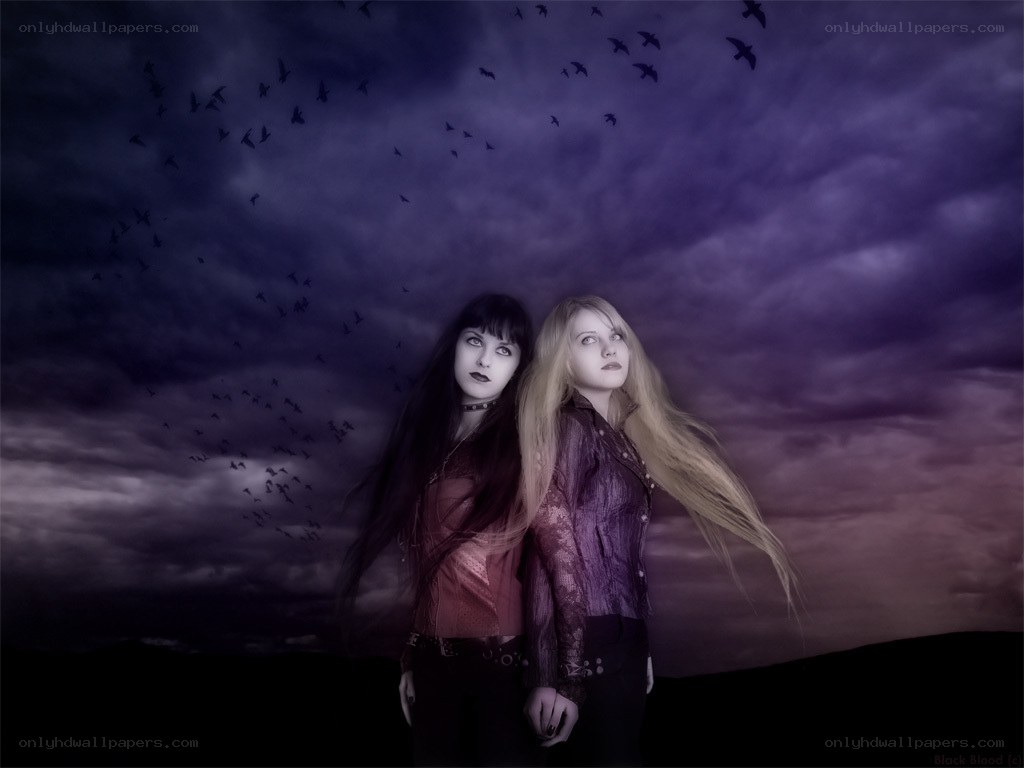two women under a dark sky