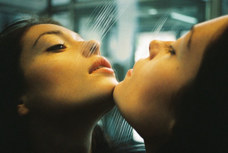 two women under shower spray