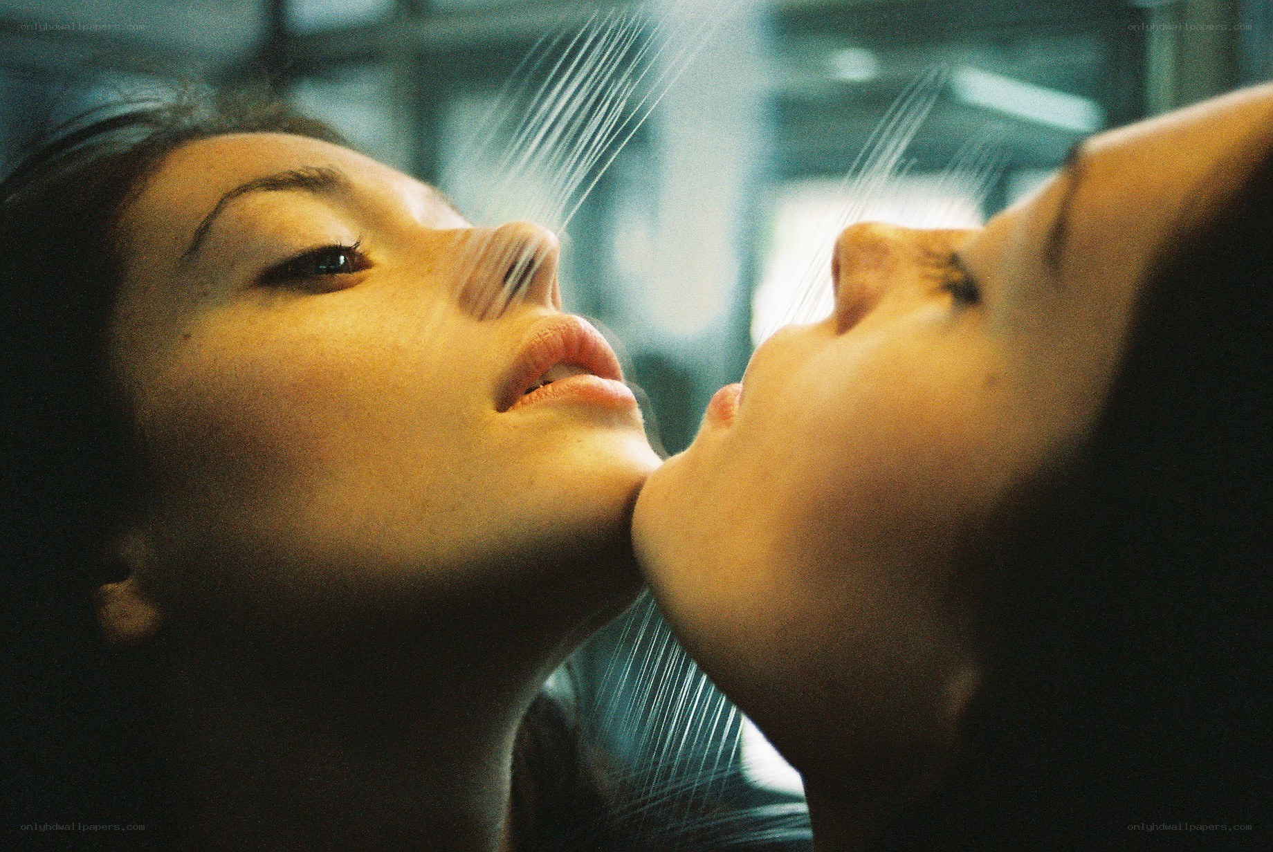 two women under shower spray