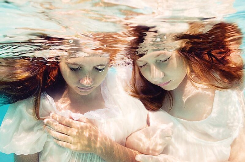 Two Women Underwater — White