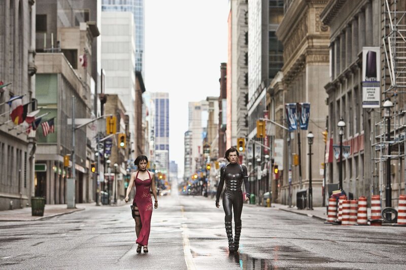 Two women walk down a city street