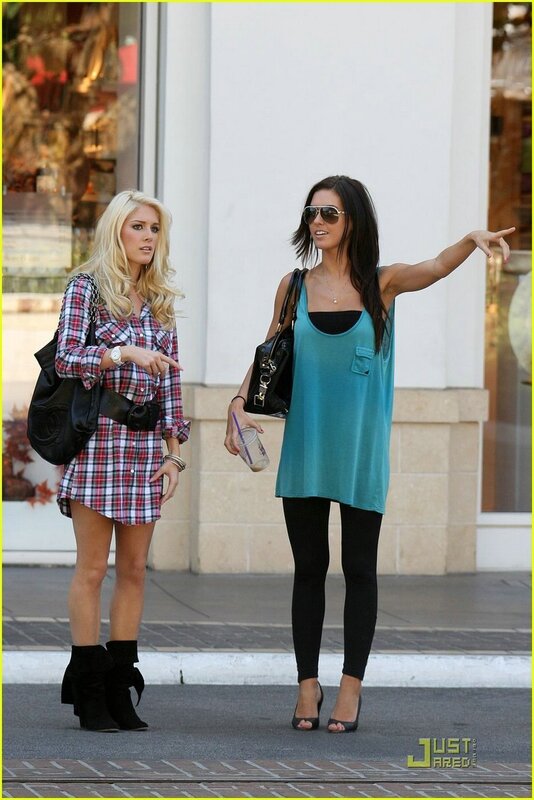 Two women walking on a street