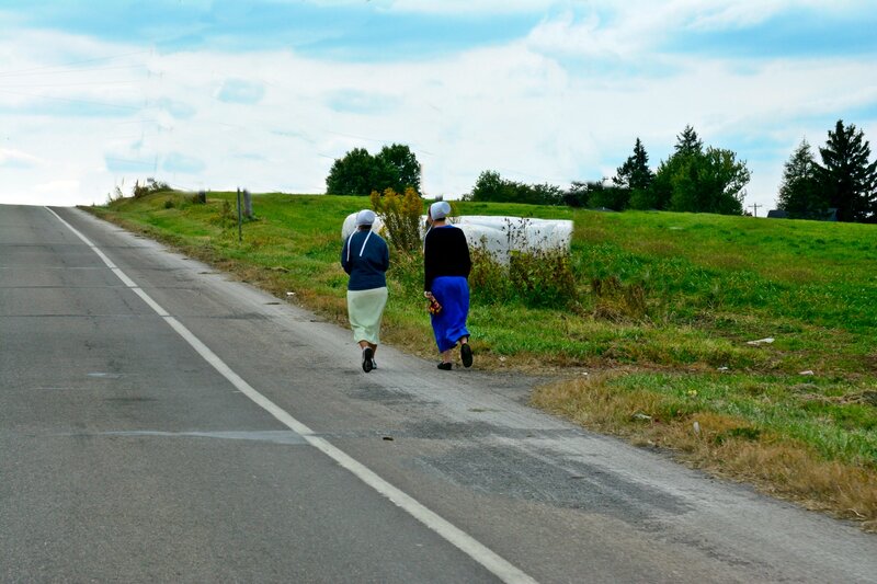 Two Women Walking on Road
