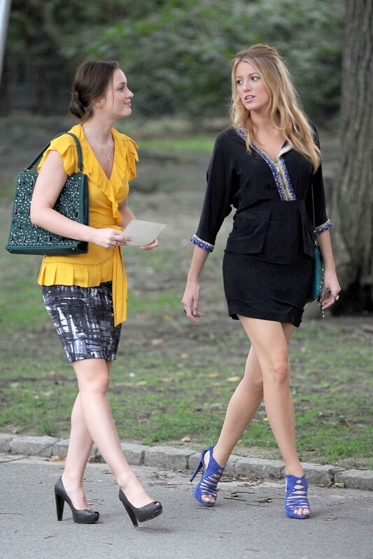 two women walking on street