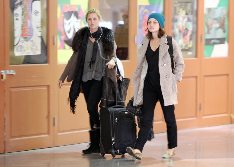 Two women walking with luggage