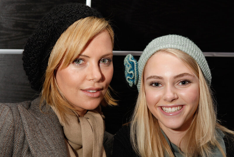 Two Women Wearing Hats — Black