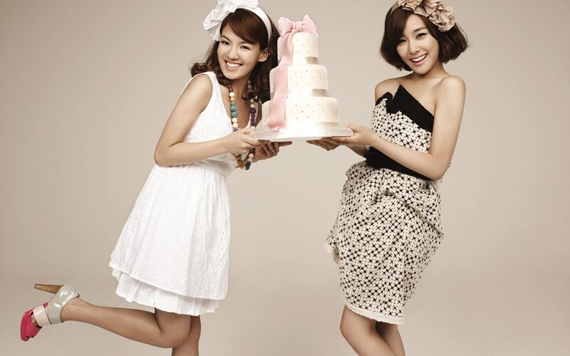 Two women with a cake