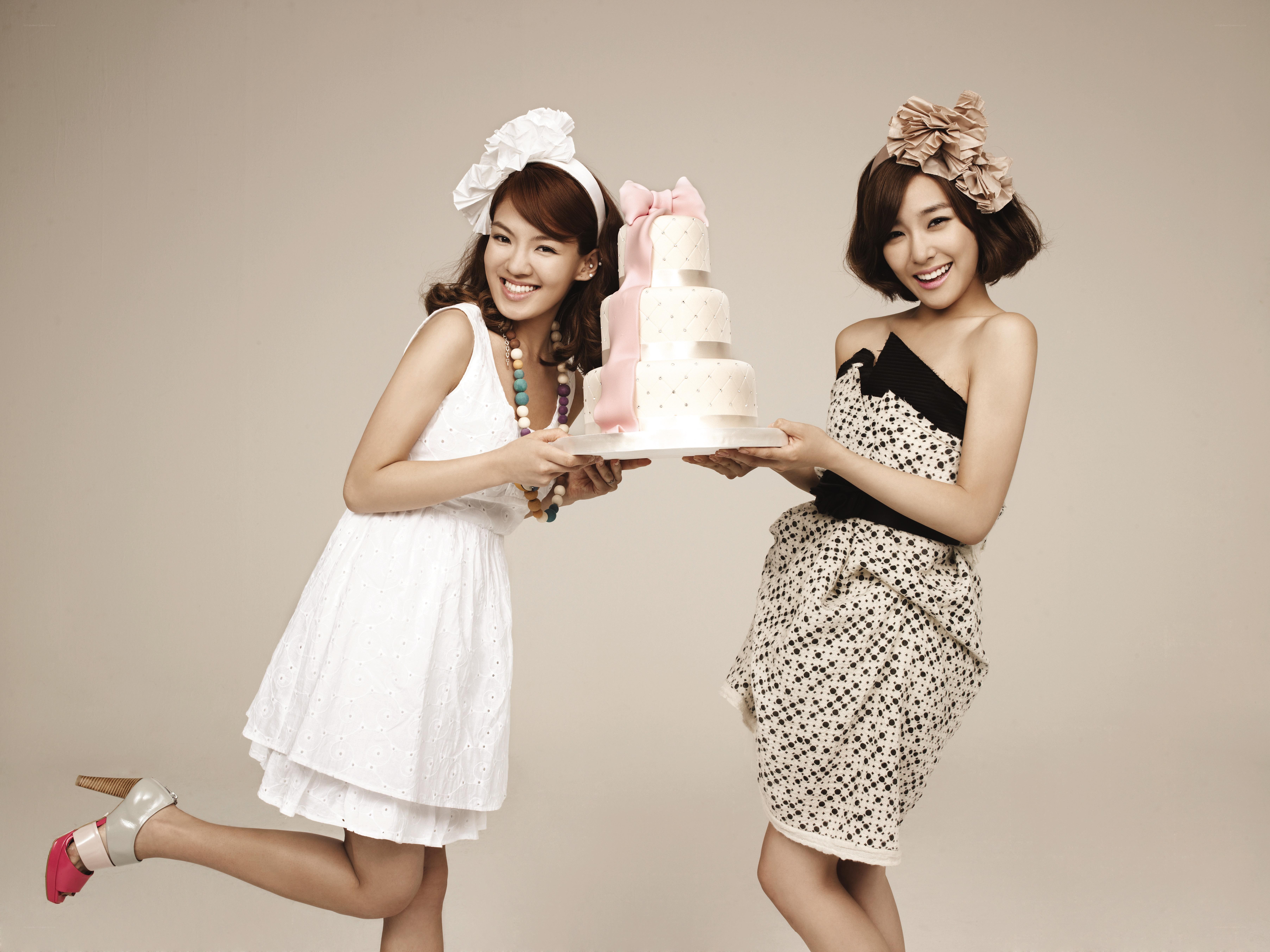 Two women with a cake