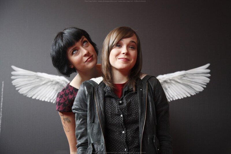 Two women with angel wings