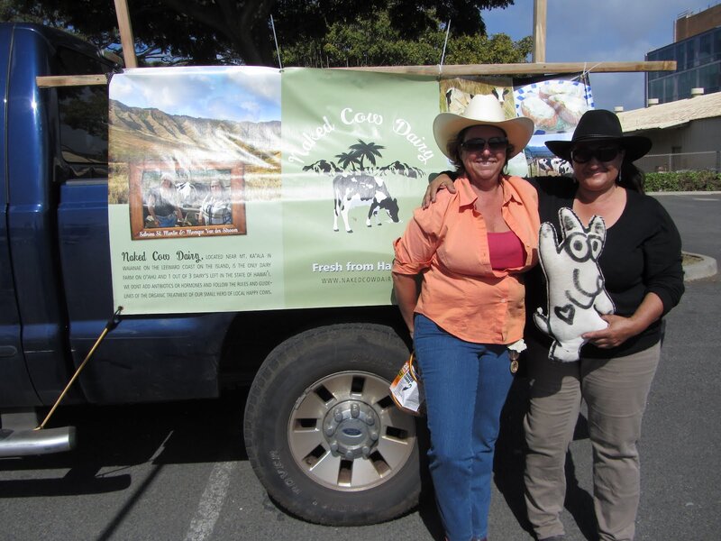 Two Women with Cow Sign